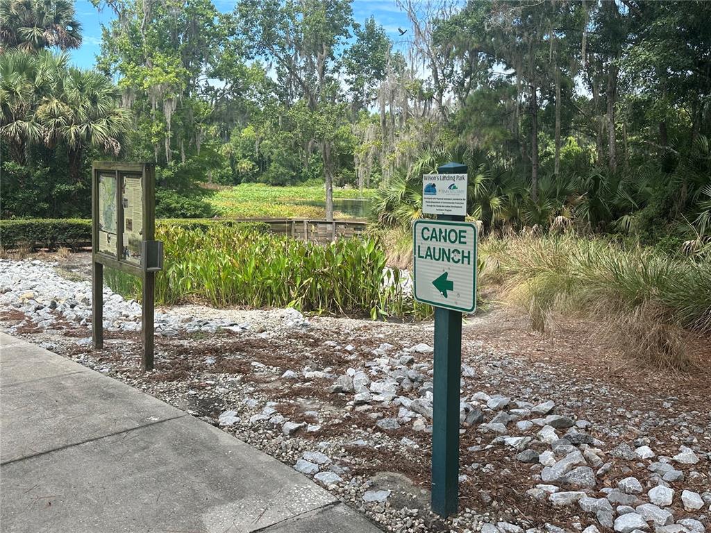 8692 Crested Eagle Place Sanford, FL 32771 - Photo 54 of 56 a street sign on a sidewalk next to a road