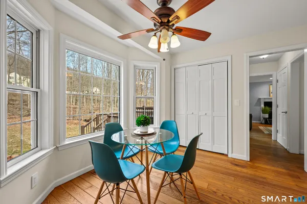 a white toilet sitting next to a bathroom sink
