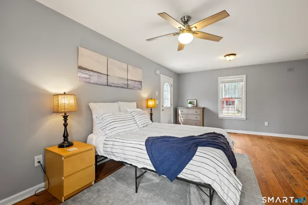 a bedroom with a bed and a view of bedroom