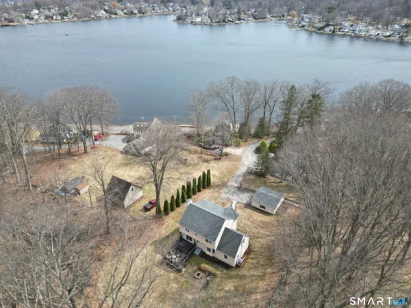 a view of a lake with houses in the back
