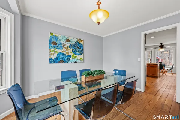 a living room with furniture a fireplace and a window