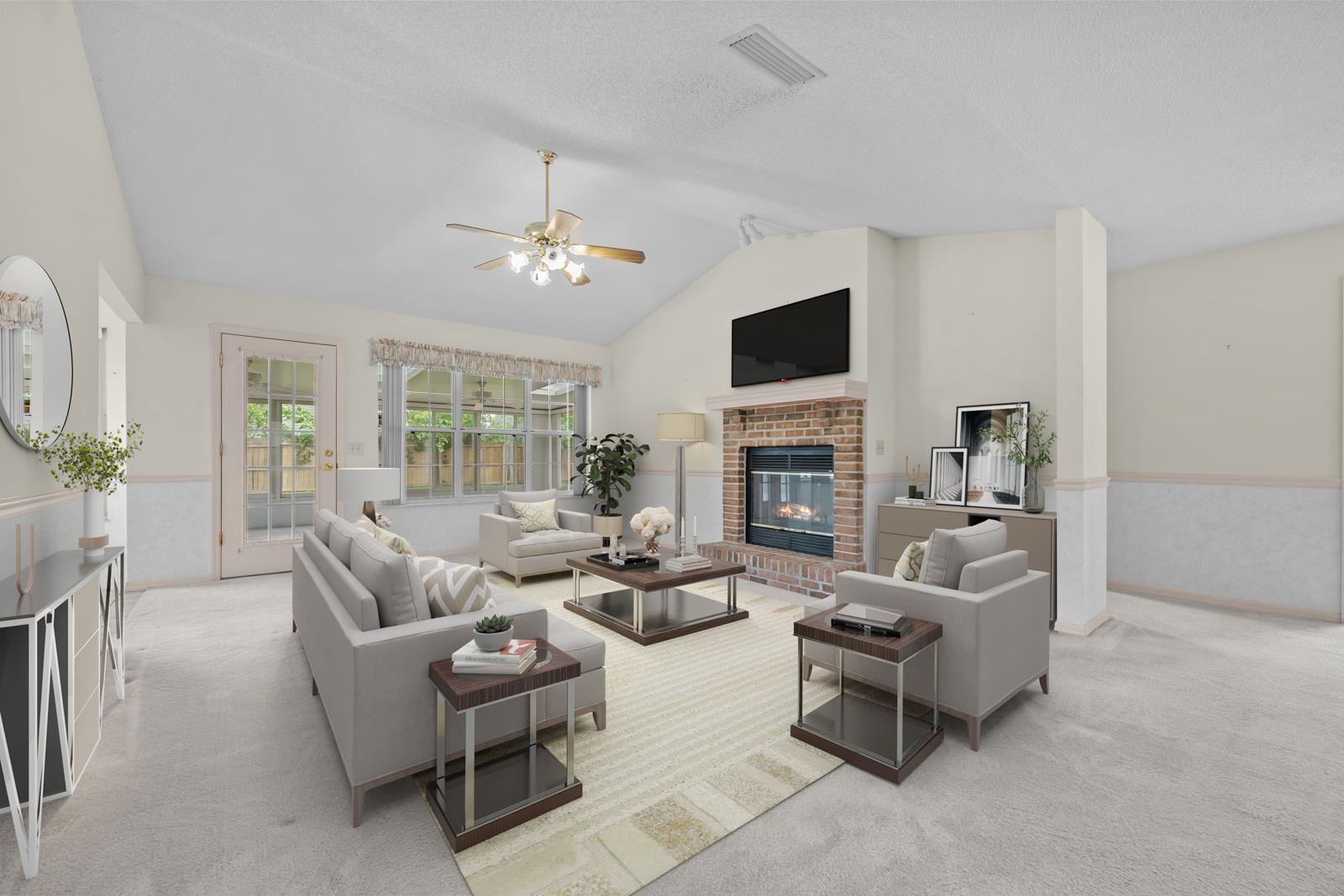 512 Moultrie Wells Road St. Augustine, FL 32086 - Photo 14 of 51 a living room with furniture fireplace and a flat screen tv