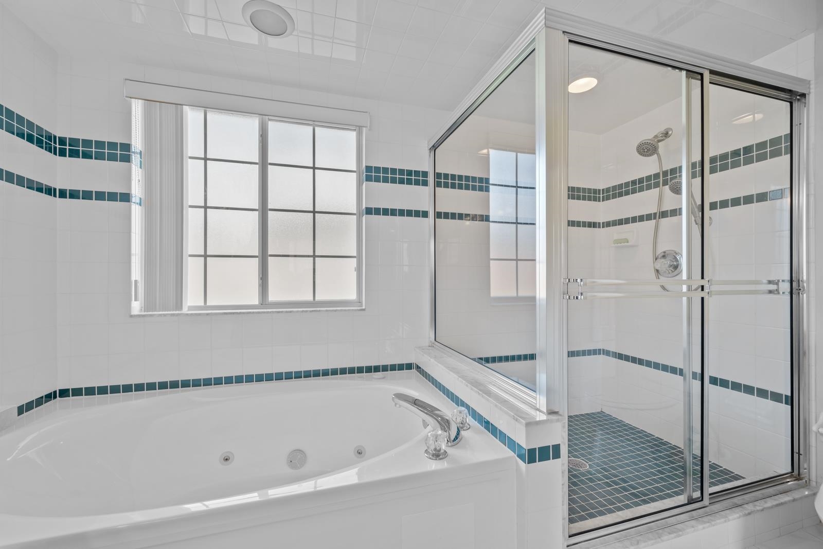 512 Moultrie Wells Road St. Augustine, FL 32086 - Photo 24 of 51 a bathroom with a bathtub and a shower