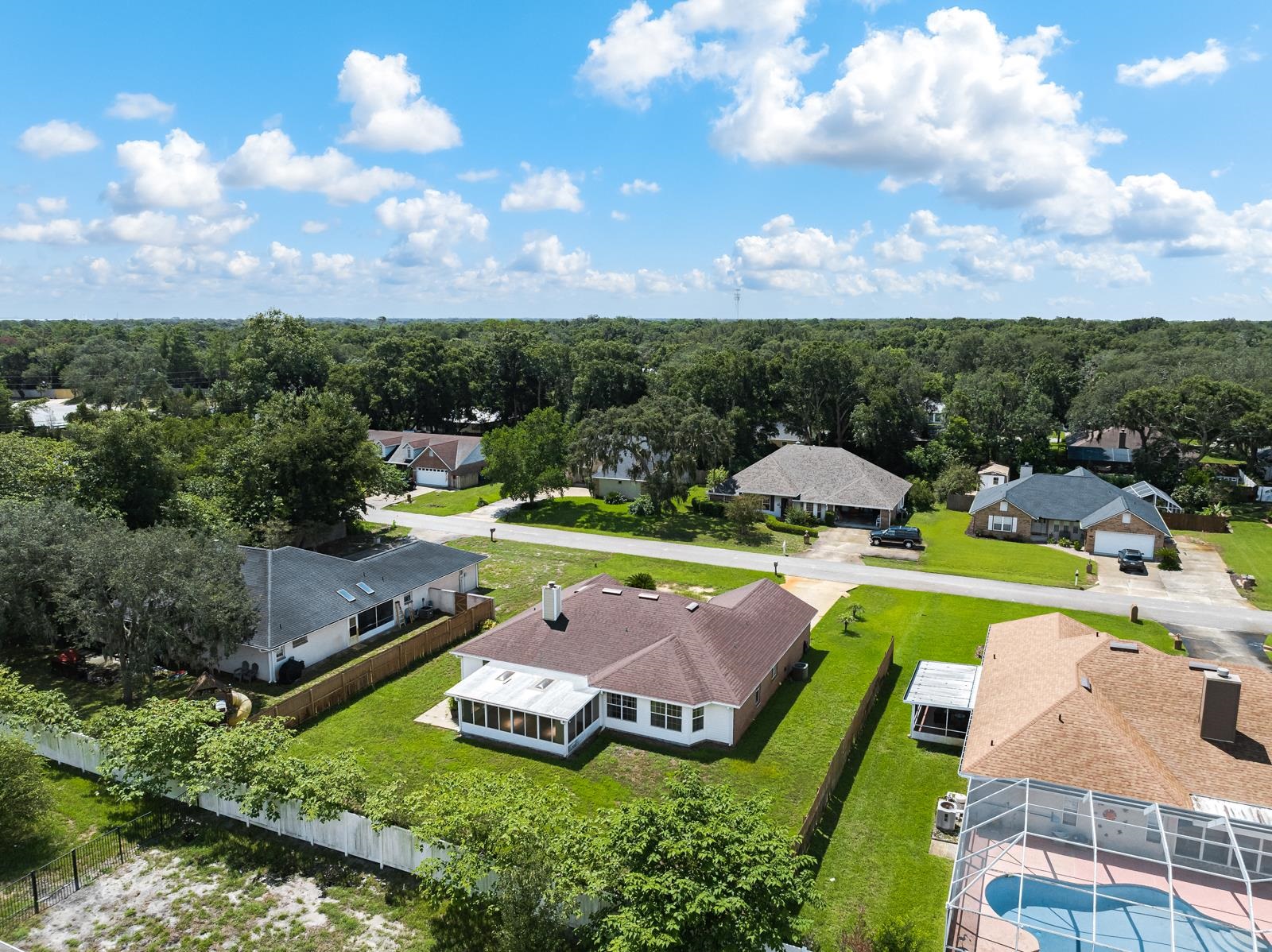 512 Moultrie Wells Road St. Augustine, FL 32086 - Photo 40 of 51 an aerial view of a house with swimming pool a yard and lake view