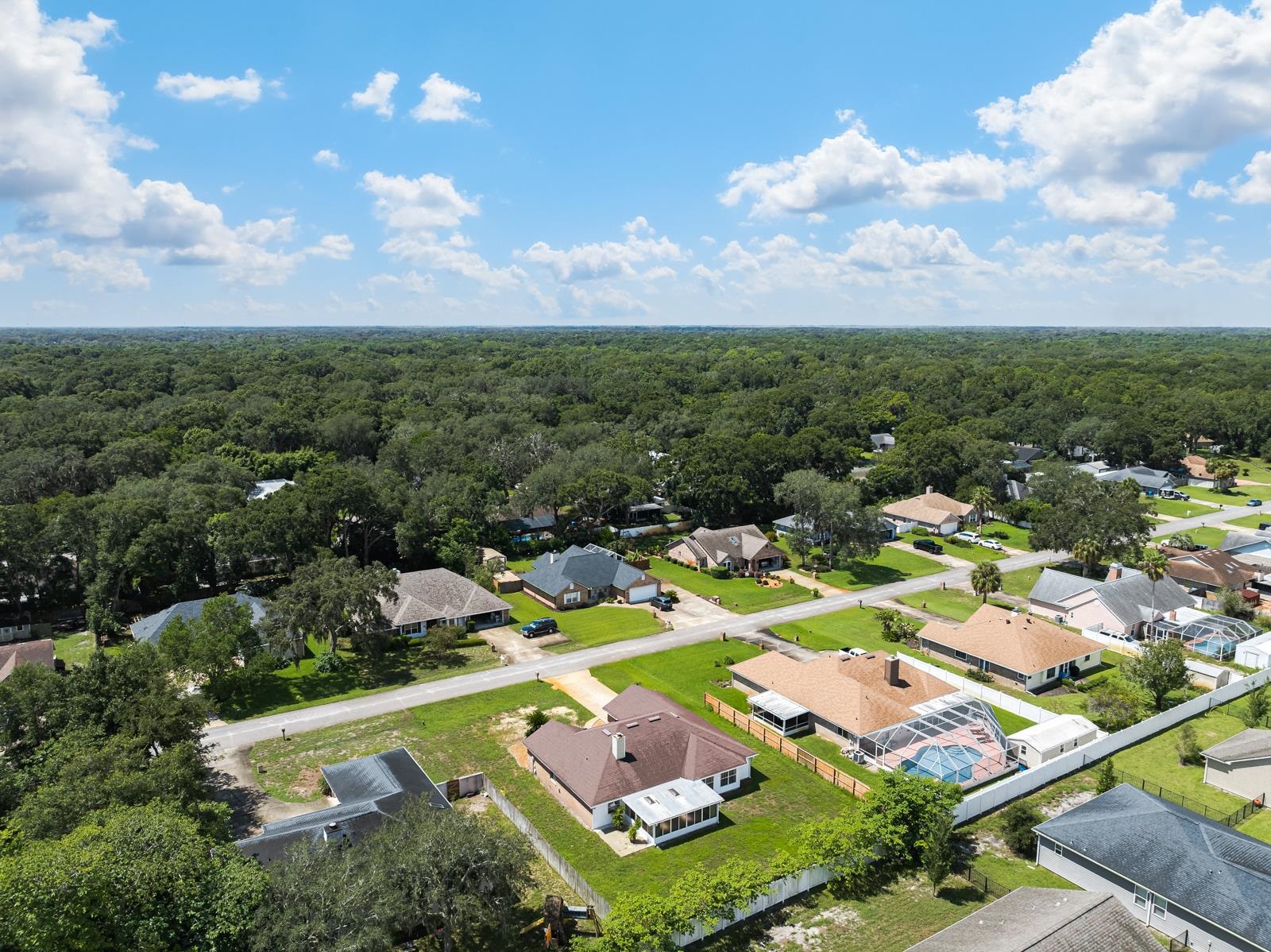 512 Moultrie Wells Road St. Augustine, FL 32086 - Photo 42 of 51 an aerial view of a city with lots of residential buildings ocean and mountain view in back