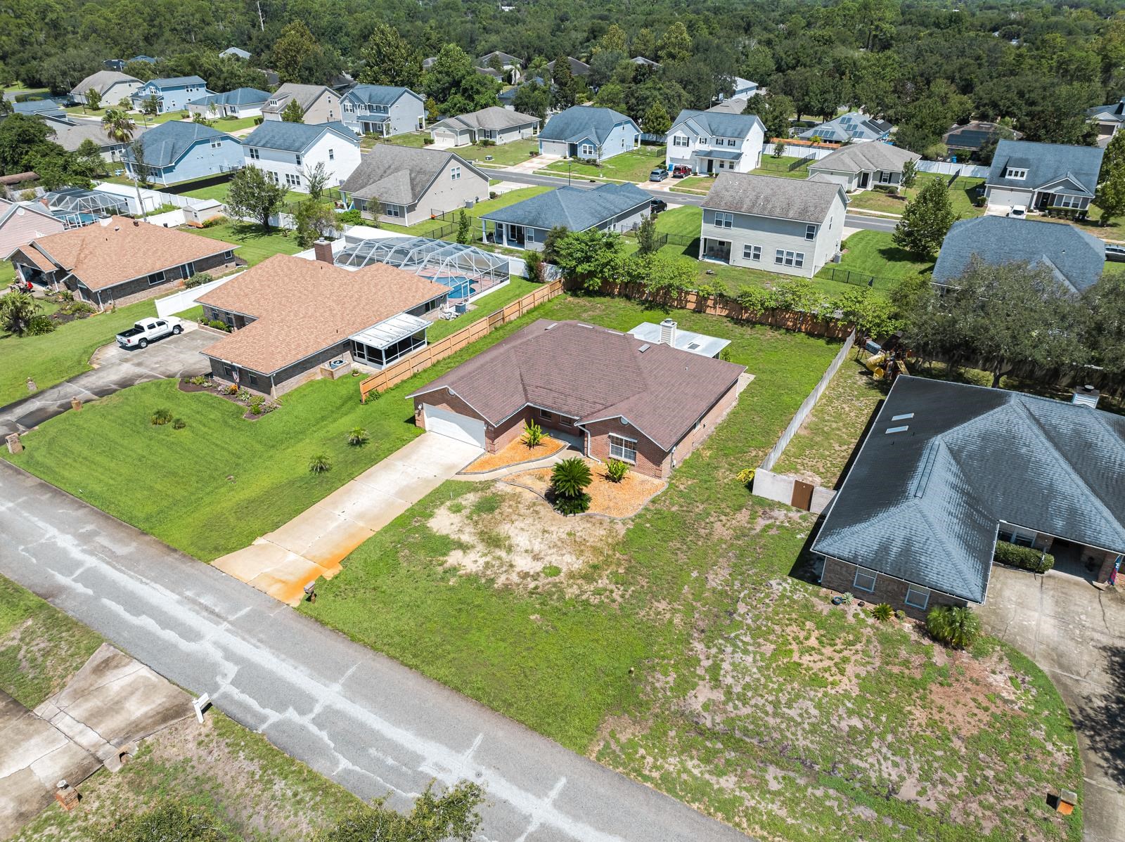 512 Moultrie Wells Road St. Augustine, FL 32086 - Photo 45 of 51 a view of multiple houses with yard