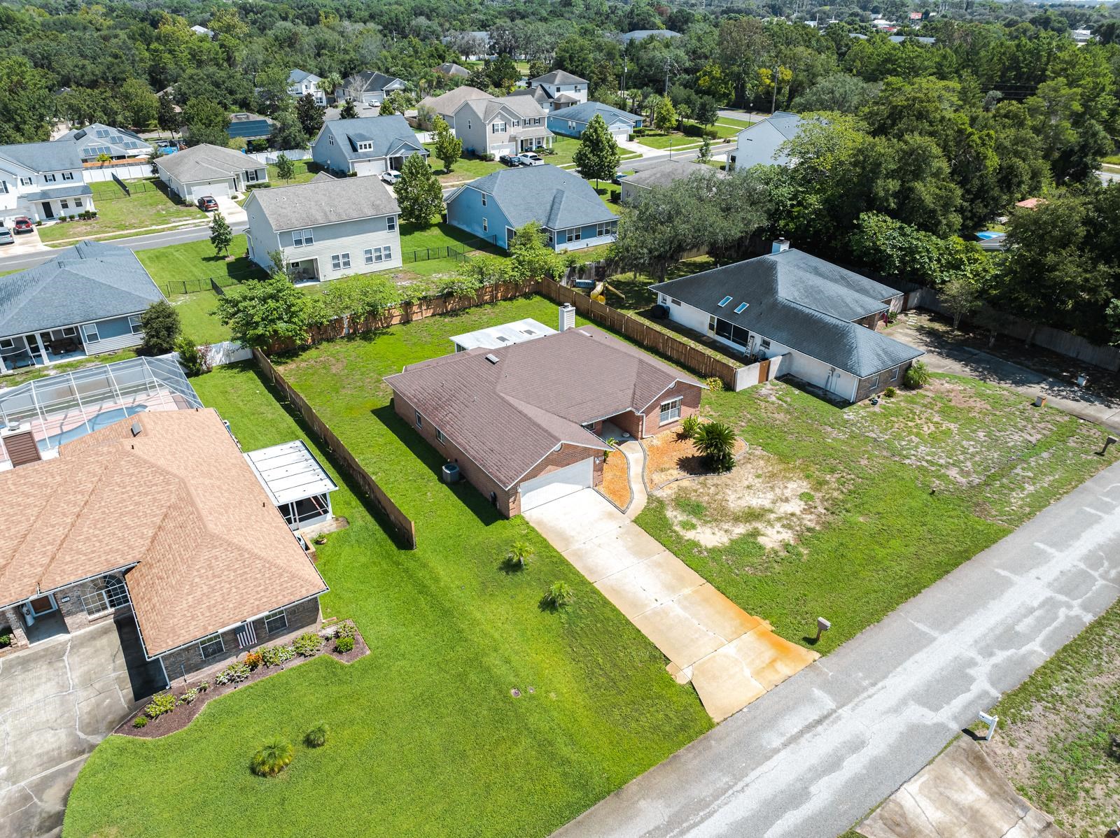 512 Moultrie Wells Road St. Augustine, FL 32086 - Photo 48 of 51 an aerial view of residential houses with outdoor space