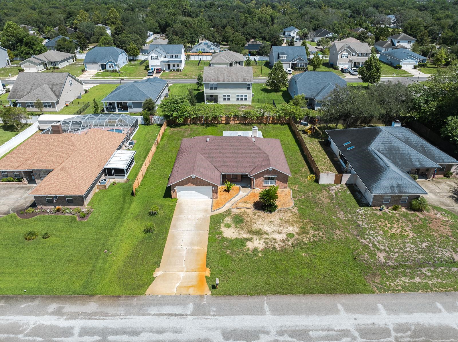 512 Moultrie Wells Road St. Augustine, FL 32086 - Photo 49 of 51 an aerial view of a house with a garden