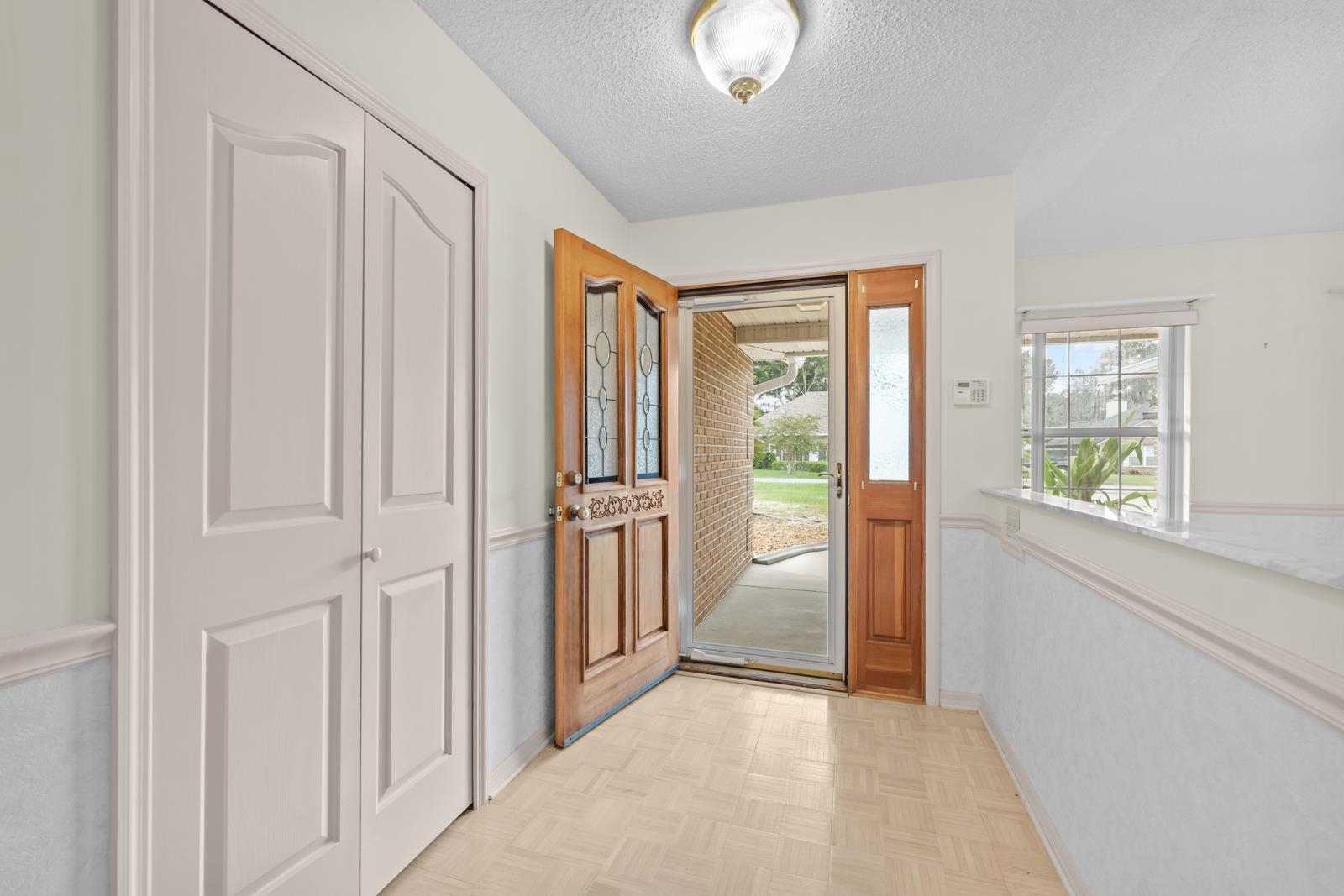 512 Moultrie Wells Road St. Augustine, FL 32086 - Photo 7 of 51 a view of a hallway with wooden floor and doors