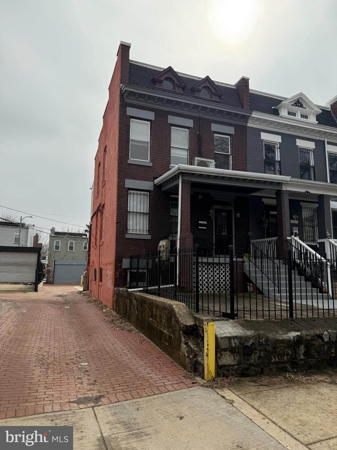 Charming urban duplex with inviting entrance.