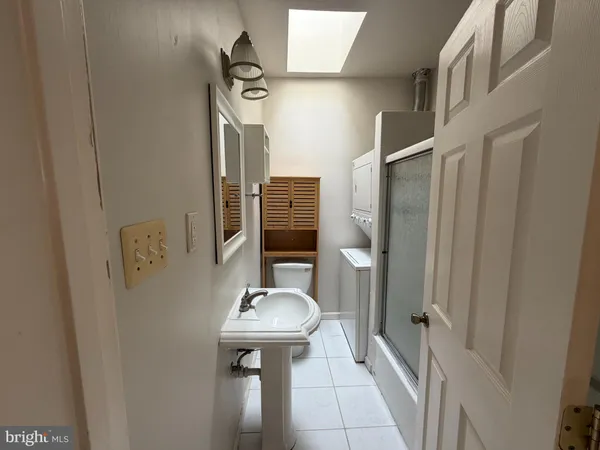 a bathroom with a sink and mirror
