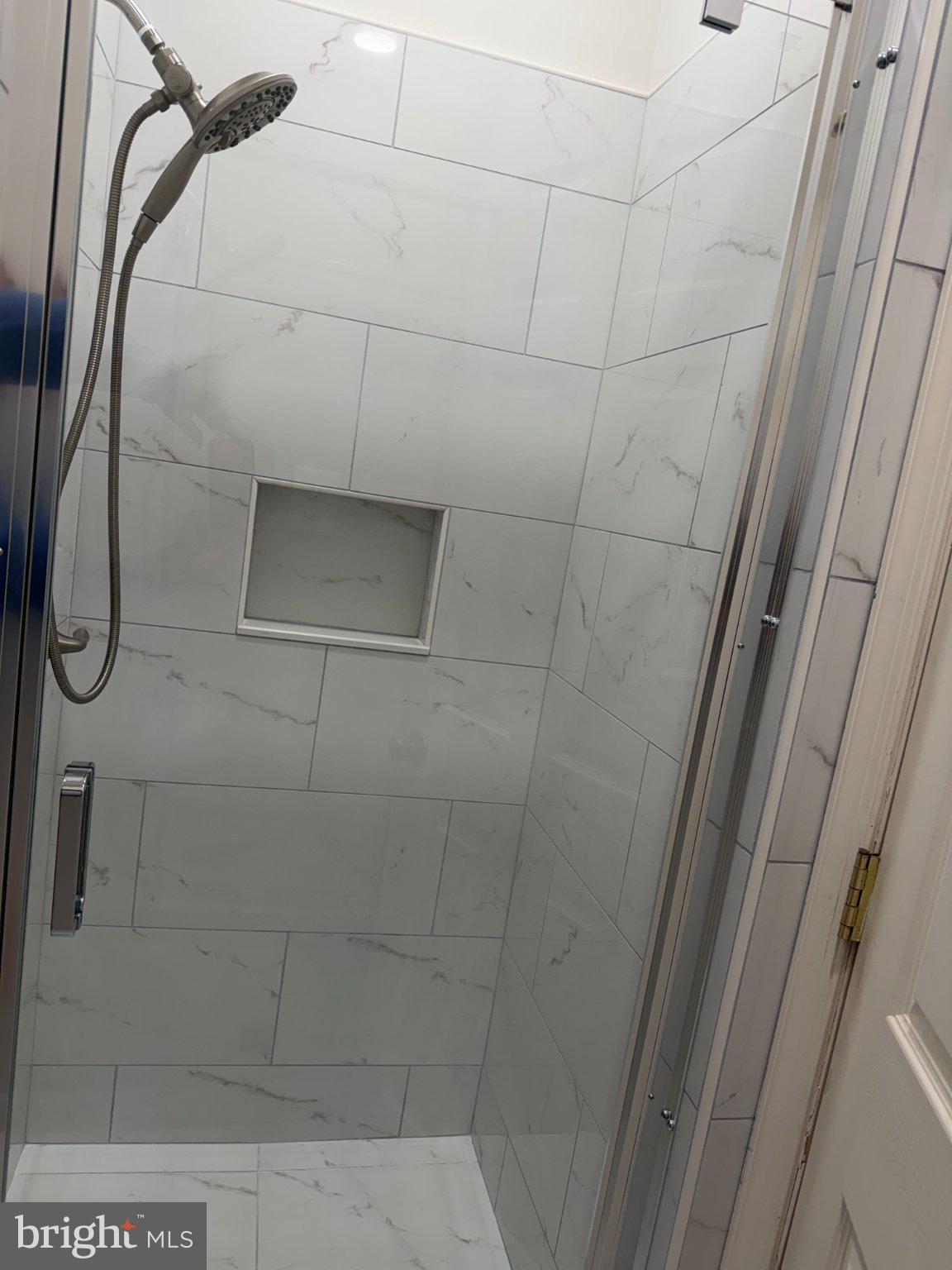 600 Keefer Place Northwest, Unit 3 Washington, DC 20010 - Photo 21 of 21 Sleek modern shower with elegant tiles.