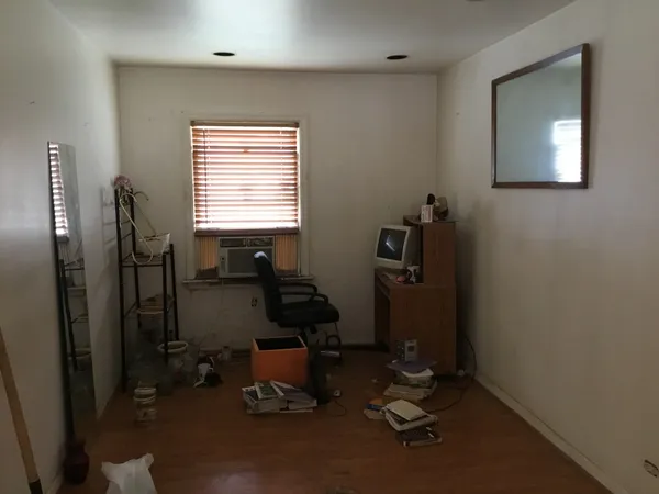 a room with gym equipment and a window