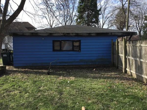 a view of house with backyard