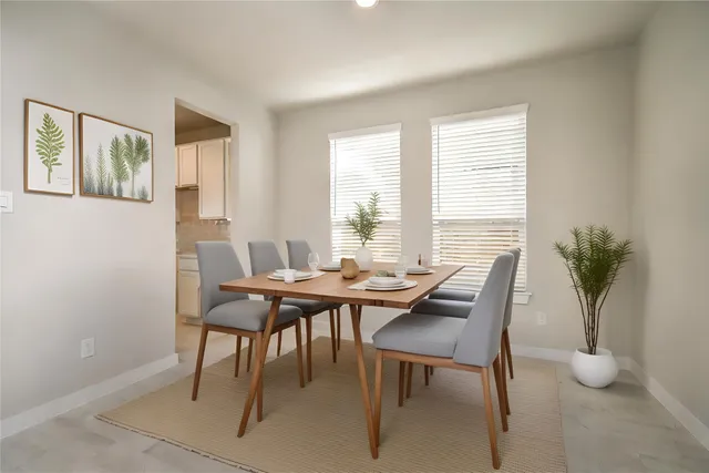 a view of kitchen with kitchen island sink and refrigerator