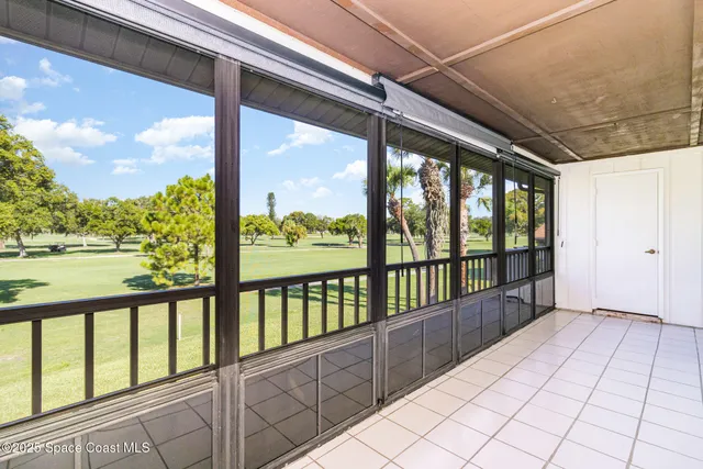 a view of an empty room with a large window
