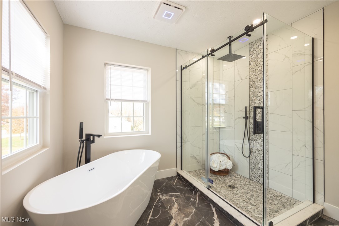 2443 Rockefeller Road Wickliffe, OH 44092 - Photo 28 of 41 Bathroom featuring tile flooring and shower with separate bathtub
