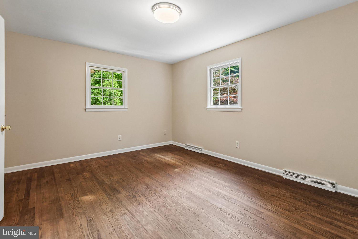 1518 Winchester Road Annapolis, MD 21409 - Photo 34 of 70 an empty room with wooden floor and windows