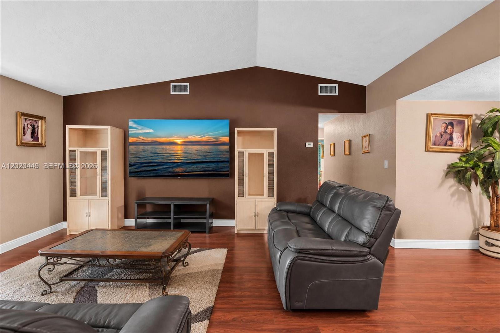 11061 Southwest 163rd Street Miami, FL 33157 - Photo 14 of 42 a living room with furniture and a flat screen tv