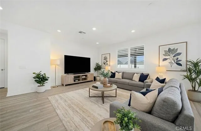 a kitchen with stainless steel appliances white cabinets and stove