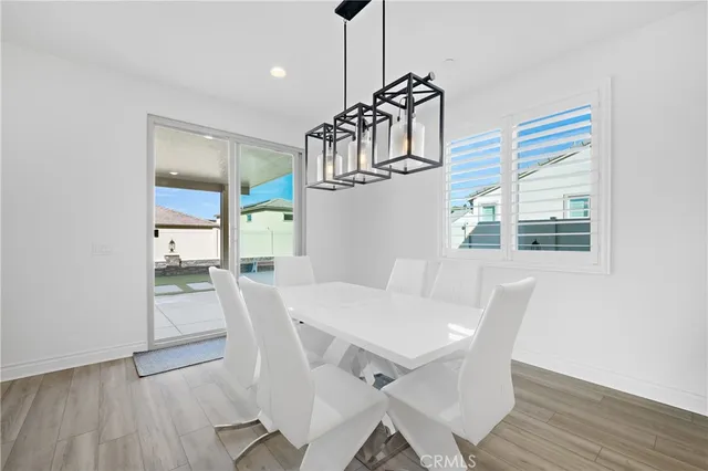 a bed room with a bed and a potted plant