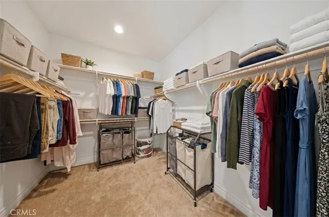 a bathroom with a granite countertop sink a toilet and a large mirror