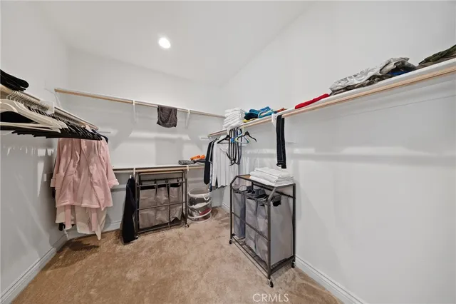 a bedroom with a bed and a desk