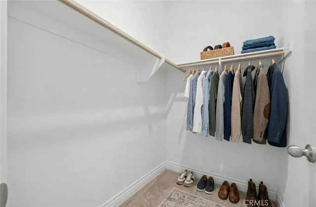 a bathroom with a toilet a sink and a mirror