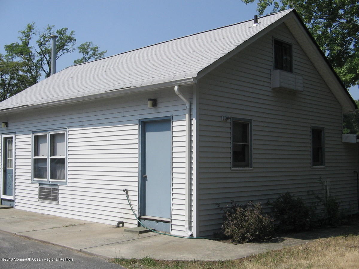 413 Oak Glen Road Howell, NJ 07731 - Photo 2 of 6 a view of a house with a yard