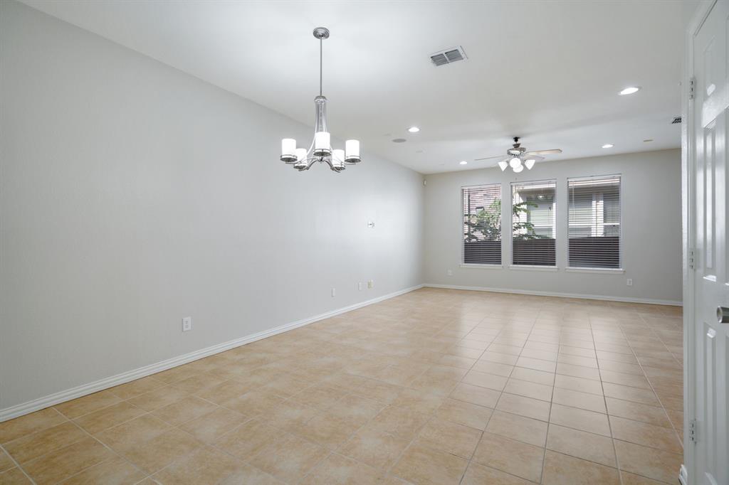 6407 Capulet Place Dallas, TX 75252 - Photo 11 of 33 a view of an empty room with a chandelier