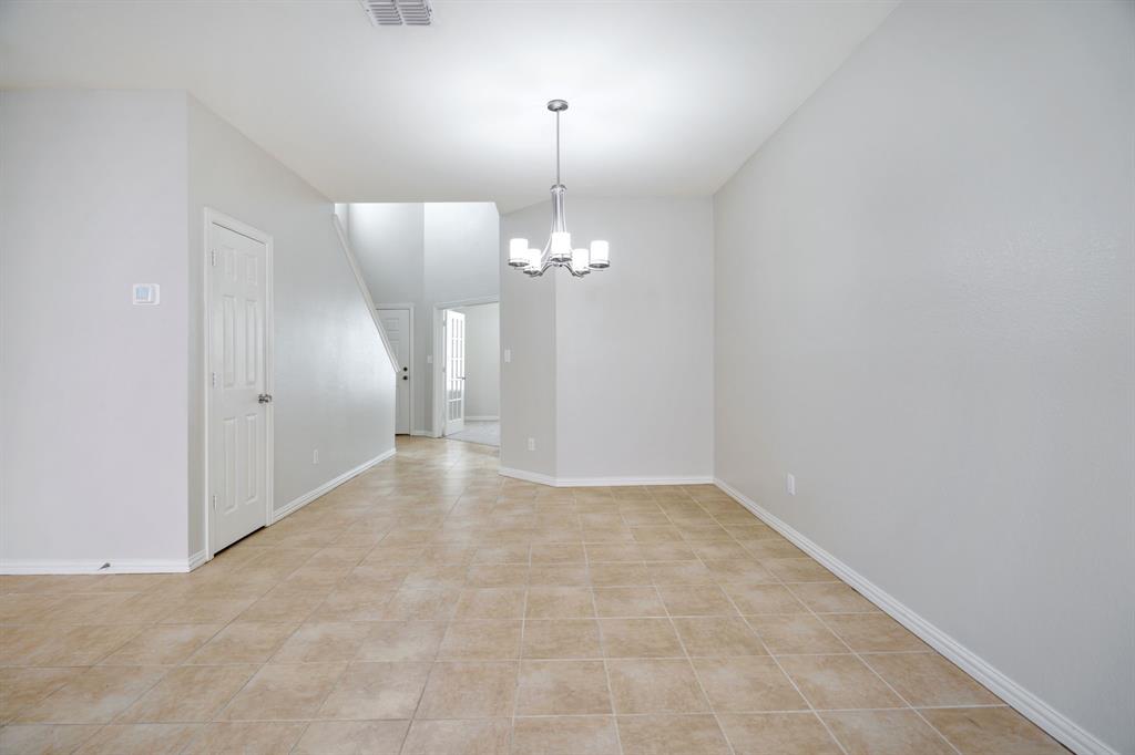 6407 Capulet Place Dallas, TX 75252 - Photo 12 of 33 a view of a chandelier in big room and chandelier