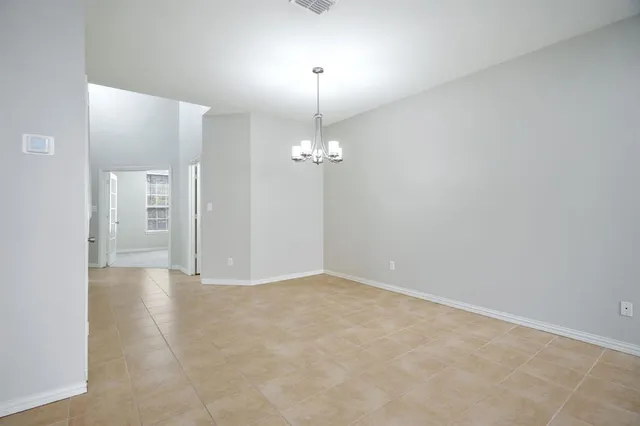a view of a chandelier fan in a room