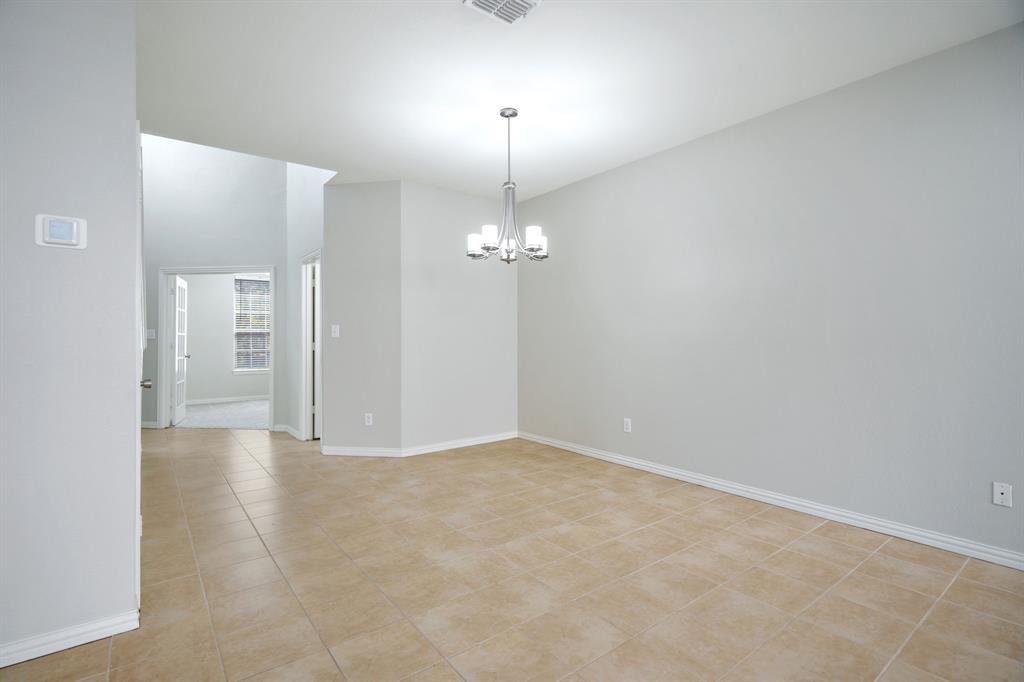 6407 Capulet Place Dallas, TX 75252 - Photo 13 of 33 a view of a chandelier fan in a room