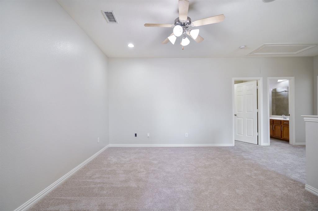 6407 Capulet Place Dallas, TX 75252 - Photo 21 of 33 an empty room with a ceiling fan and a window