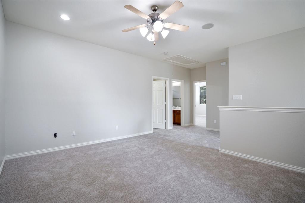 6407 Capulet Place Dallas, TX 75252 - Photo 22 of 33 an empty room with fan and a ceiling fan