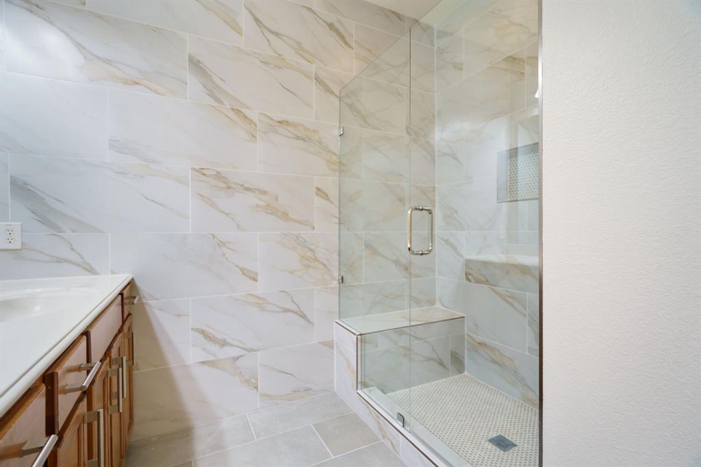6407 Capulet Place Dallas, TX 75252 - Photo 24 of 33 a bathroom with a shower