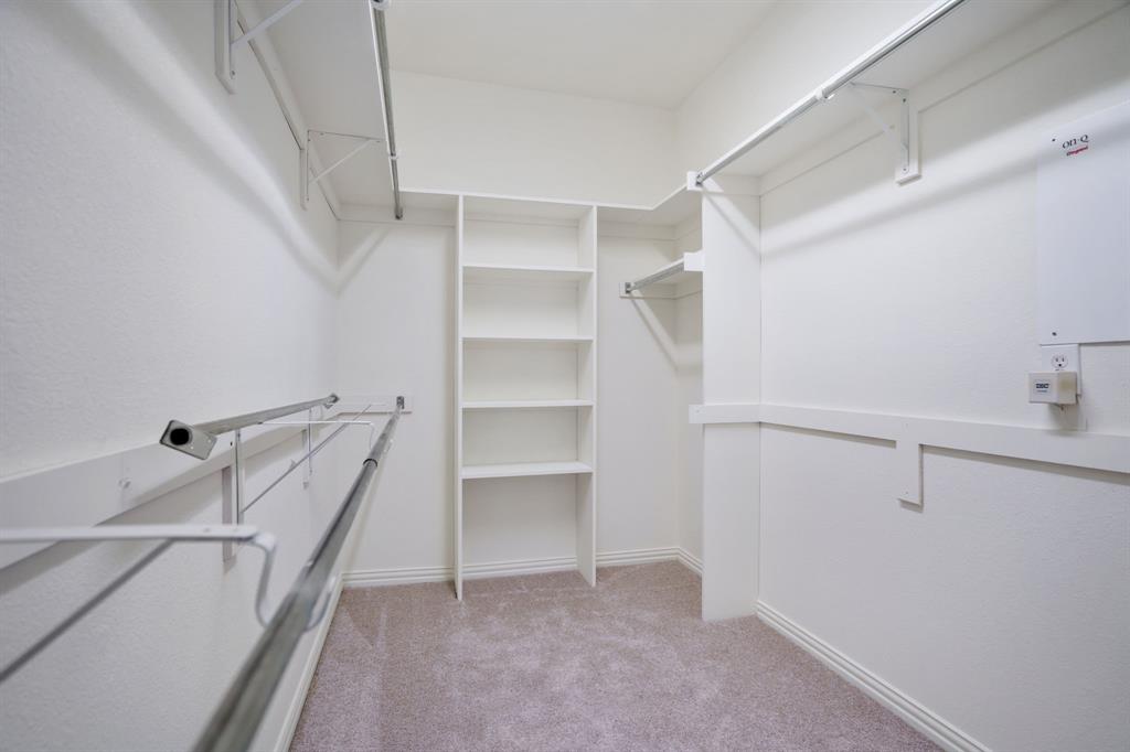 6407 Capulet Place Dallas, TX 75252 - Photo 26 of 33 a view of an empty walk in closet