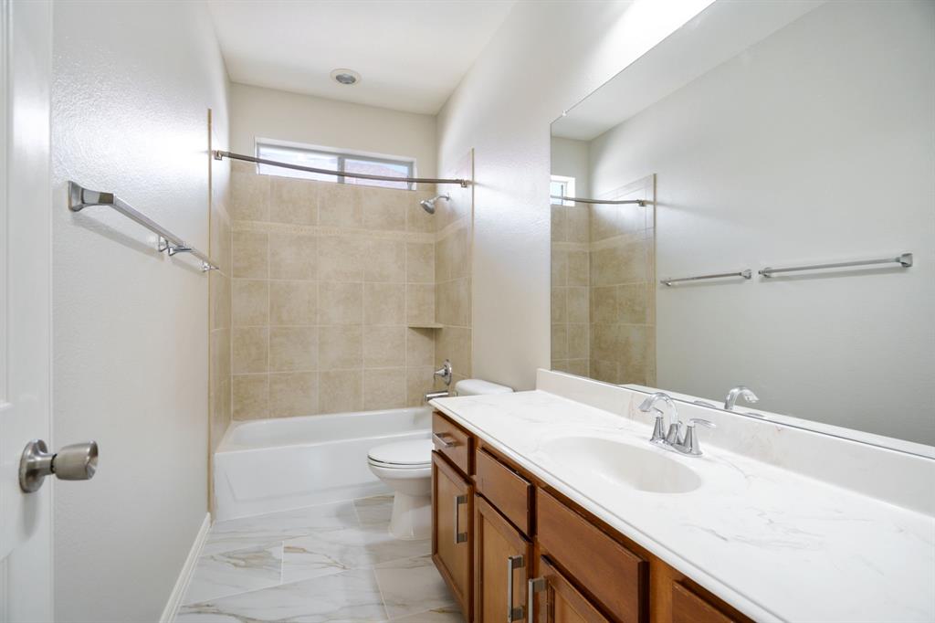 6407 Capulet Place Dallas, TX 75252 - Photo 29 of 33 a bathroom with a double vanity sink mirror double and shower
