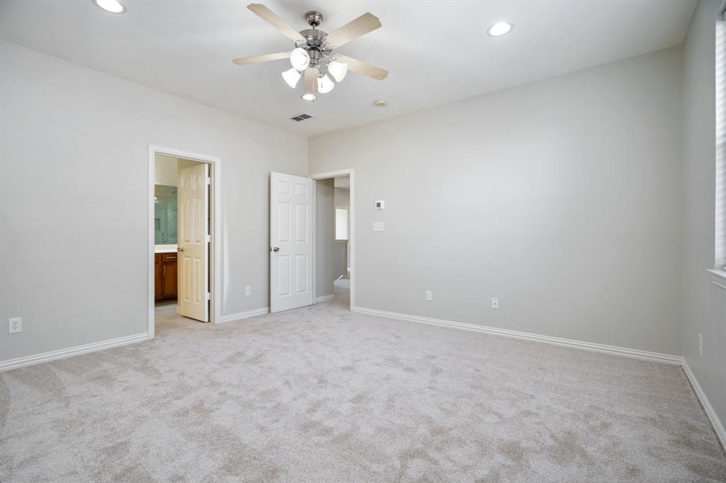 6407 Capulet Place Dallas, TX 75252 - Photo 30 of 33 an empty room with chandelier fan