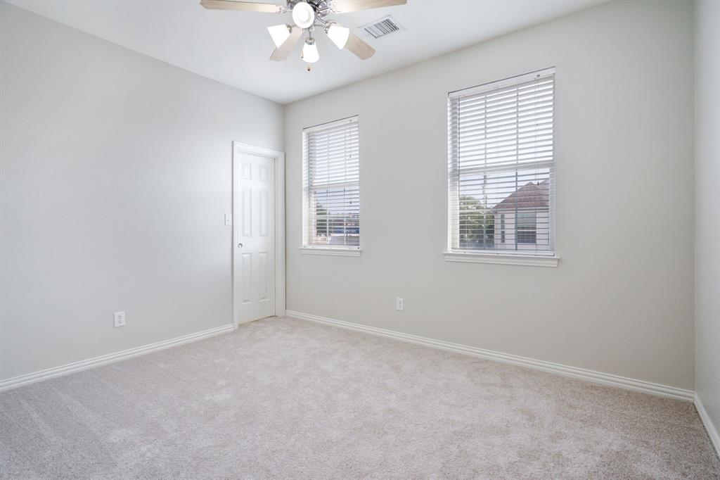 6407 Capulet Place Dallas, TX 75252 - Photo 31 of 33 an empty room with windows and fan