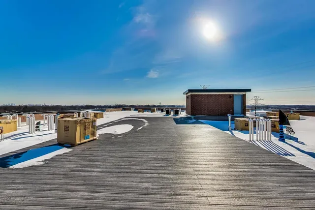 a room with wooden floor and pool table