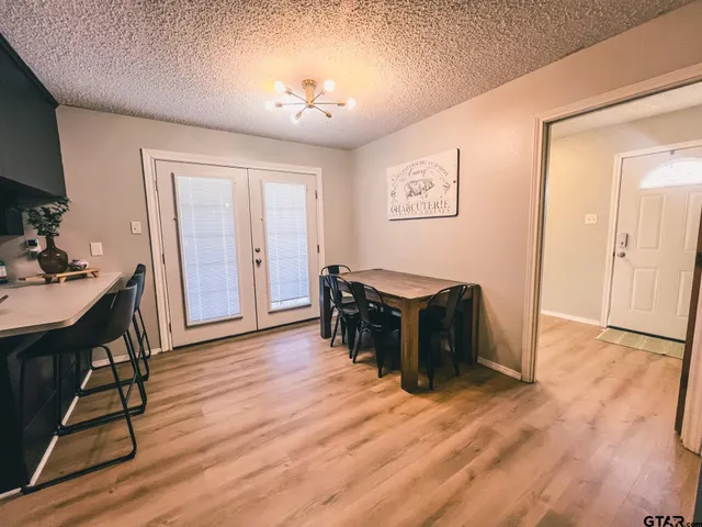 a view of a livingroom with furniture and wooden floor