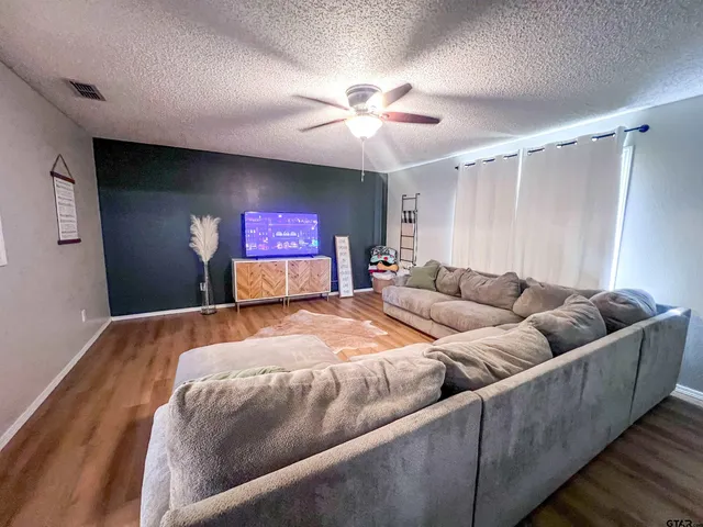 a bed room with a bed and a flat screen tv