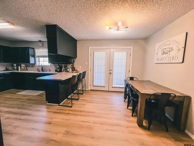 a room with a wooden floor and furniture