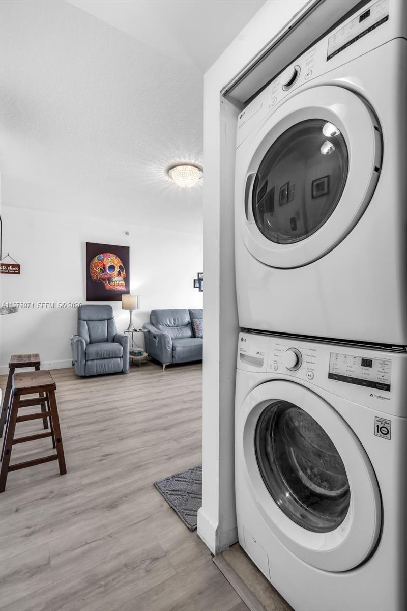 900 Southwest 8th Street, Unit 1603 Miami, FL 33130 - Photo 19 of 32 a view of a storage and utility room with washer and dryer