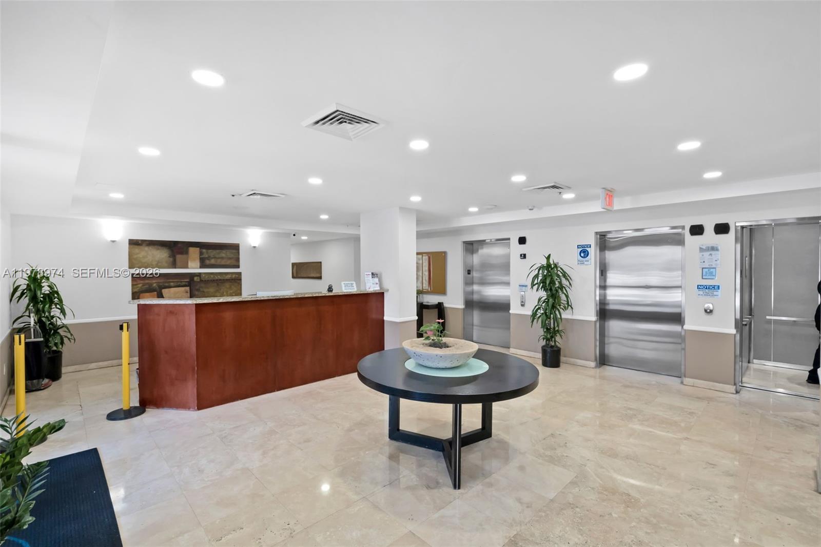 900 Southwest 8th Street, Unit 1603 Miami, FL 33130 - Photo 3 of 32 a living room with furniture a pool table and chairs