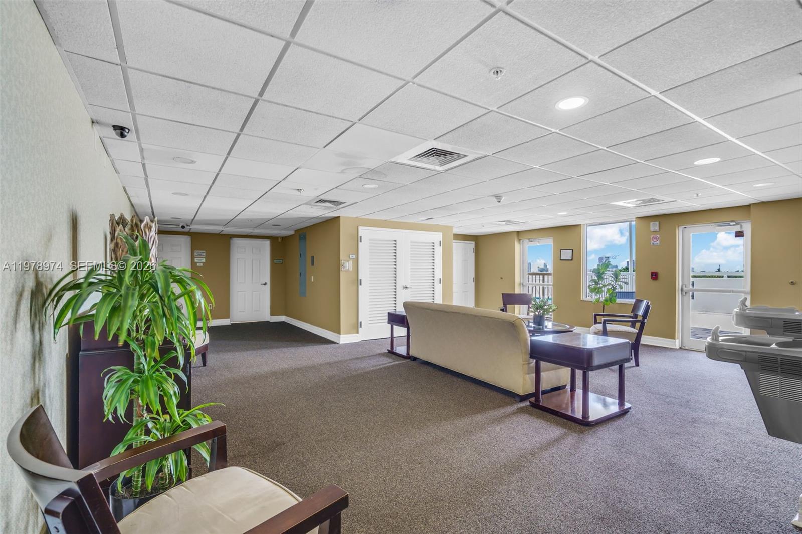 900 Southwest 8th Street, Unit 1603 Miami, FL 33130 - Photo 31 of 32 a living room with furniture and a potted plant