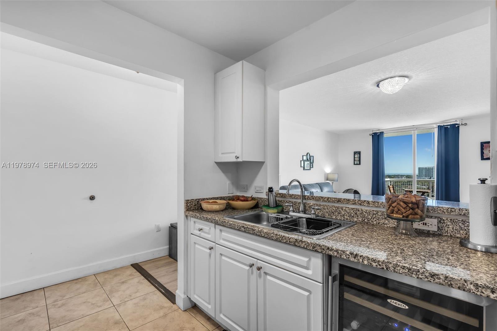 900 Southwest 8th Street, Unit 1603 Miami, FL 33130 - Photo 7 of 32 a kitchen with a sink and cabinets