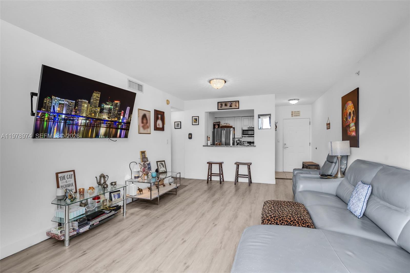 900 Southwest 8th Street, Unit 1603 Miami, FL 33130 - Photo 10 of 32 a living room with furniture and a wooden floor