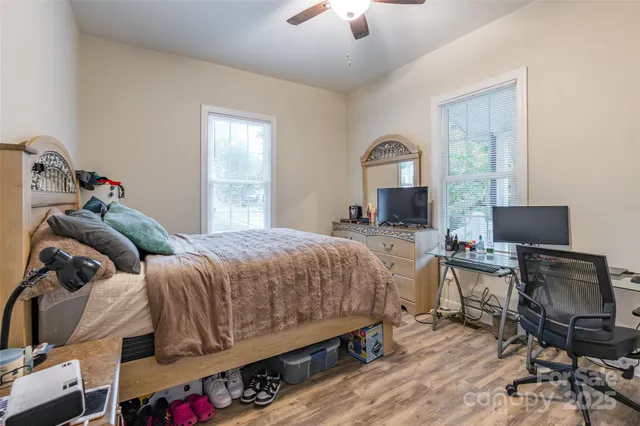 a bedroom with a bed and a chair